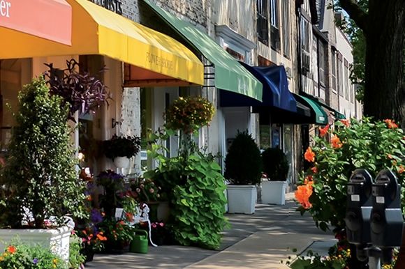 a photo of colorful canopys in a small village named Bronxville in New York